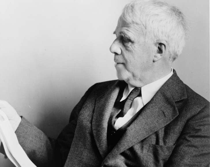 Poet Robert Frost posing for a photo